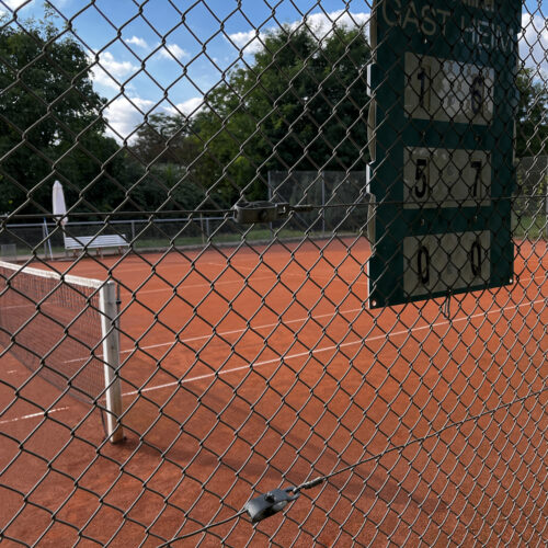 An empty clay tennis court